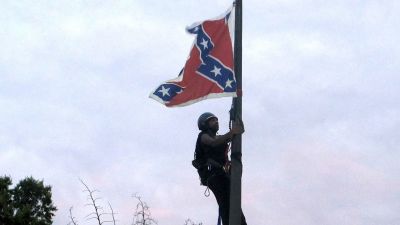 Activist Removes Confederate Flag From Monument