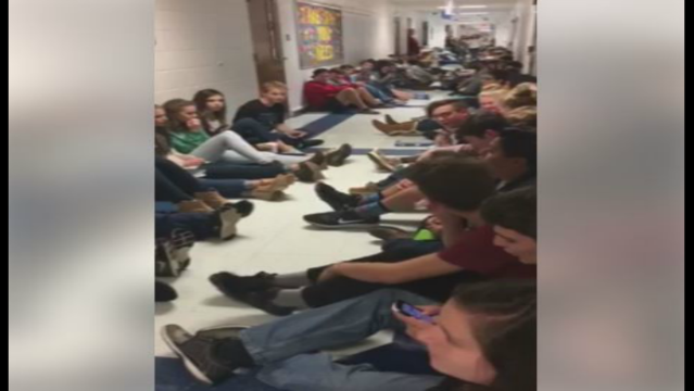 High School students sing to keep calm during storm warning